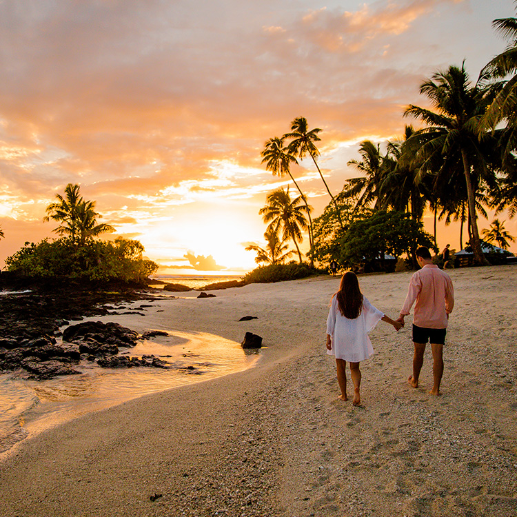 Samoa couple walk on sunset