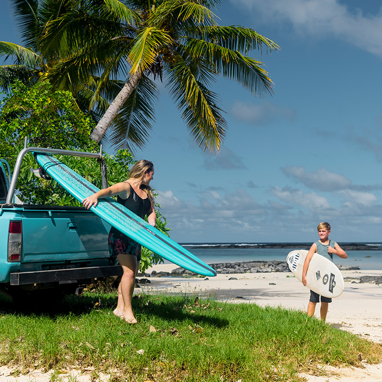 Samoa carrying surfboards